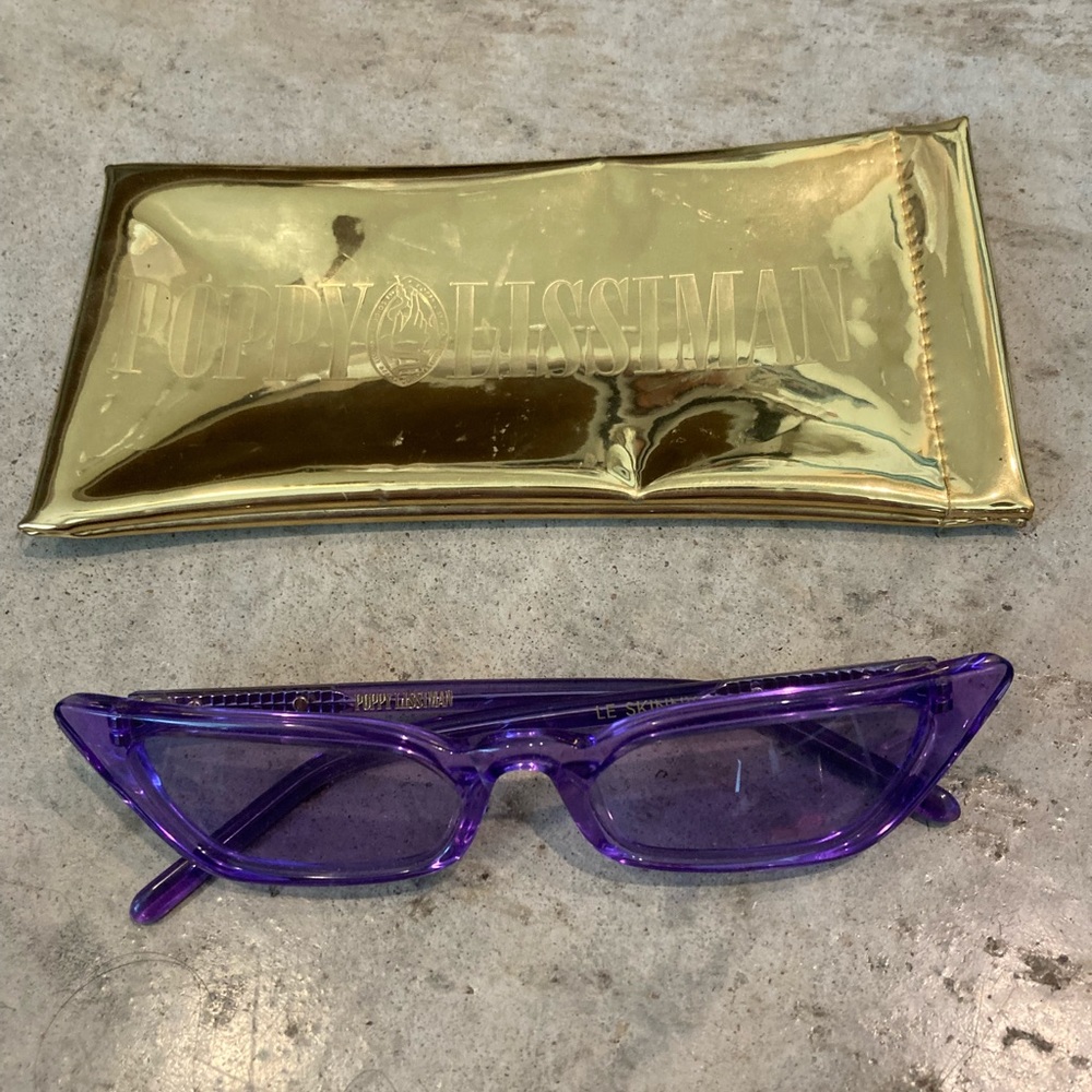 Poppy Lissiman le skinny translucent purple sunglasses with case.